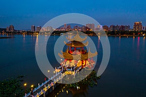 Kaohsiung`s famous tourist attractions aerial view, Beautiful decorated traditional Chinese Pagoda with Kaohsiung city in