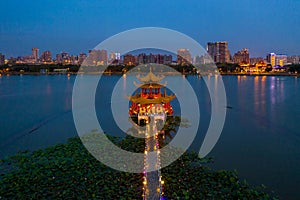 Kaohsiung`s famous tourist attractions aerial view, Beautiful decorated traditional Chinese Pagoda with Kaohsiung city in