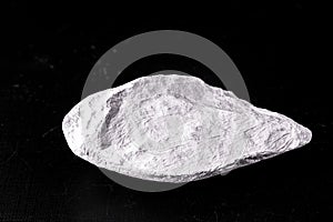 Kaolin on isolated black background, is an inorganic mineral, chemically inert