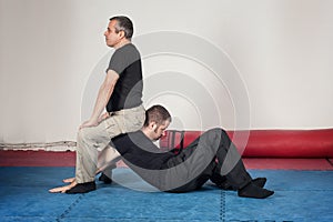 Kapap instructor demonstrates arm lock techniques