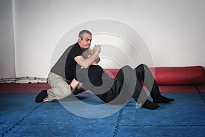 Kapap instructor demonstrates choke techniques