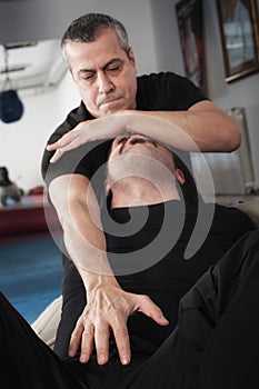 Kapap instructor demonstrates choke techniques