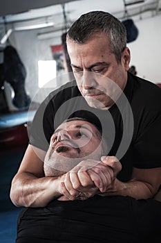 Kapap instructor demonstrates choke techniques