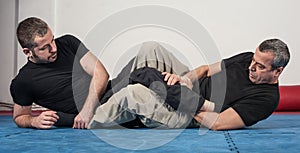 Kapap instructor demonstrates ground fighting techniques