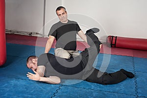Kapap instructor demonstrates ground fighting techniques