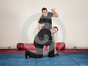 Kapap instructor demonstrates standing arm lock techniques