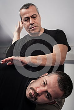 Kapap instructor demonstrates standing arm lock techniques