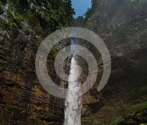 Kapas Biru Waterfall in Lumajang, East Java, Indonesia photo