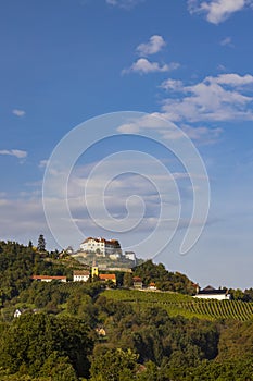 Kapfenstein castle and church with vineyard, Styria, Austria