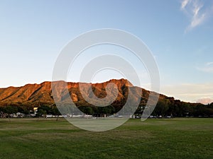 Kapiolani Park at during day with Diamond Head and clouds