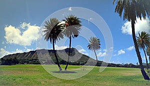 Kapiolani Park at during day with Diamond Head and clouds