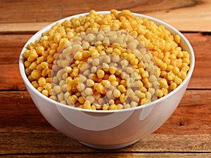 Kara Boondi or Bundi - A traditional Indian namkeen / snack and important Chat item, Served in a bowl. selective focus