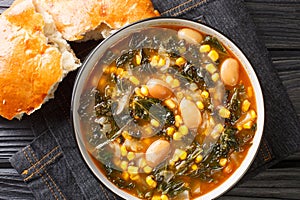 Kara lahana corbasÄ± savory cabbage soup with kale, beans and corn close-up in a bowl. Horizontal top view