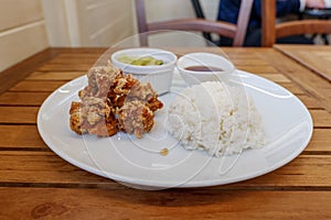 Karaage or Japanese fried chicken serve with miso soup, salad and steamed rice.