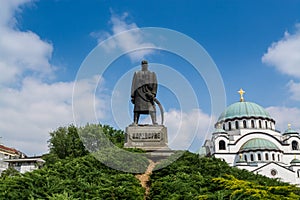 Karadjordje statue against blue sky  and church of Saint Sava, a Serbian Orthodox church located in Belgrade, Serbia