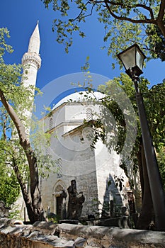 Karadoz Bey Mosque, located on Brace Fejica street, with a street lamp in the foreground