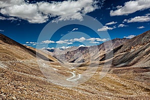 Karakoram Range and road in valley, Ladakh, India photo