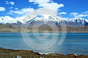 Karakul lake and pamir mountains in Xinjiang, Karakorum highway, China