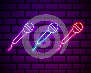 Karaoke colours glowing neon ui ux icons. Glowing sign logo vector . Microphone neon icon isolated on dark brick wall backround