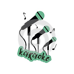 Karaoke emblem with three big, smaller and smallest green and black microphones with an inscription isolated on white