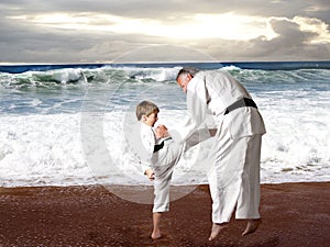 Karate boy kicking his Sensei