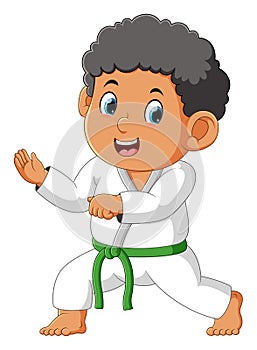 The karate boy is ready for fighting and attack the enemy