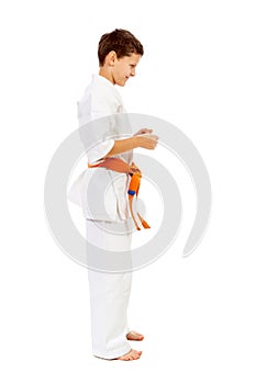 Karate boy smiling isolated on white