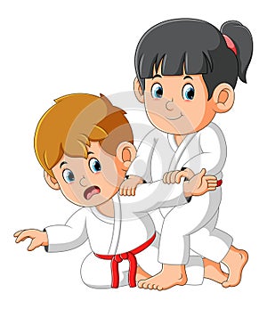 The karate couple are practicing some trick to beat enemy