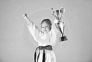 Karate fighter child. Karate sport concept. Self defence skills. Karate gives feeling of confidence. Strong and