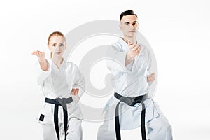 karate fighters with black belts training