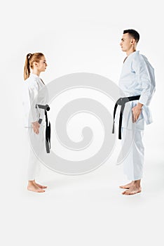 karate fighters standing and looking at each other