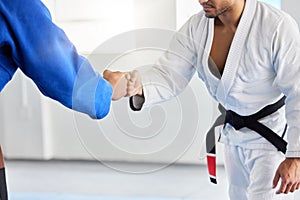 Karate, fighting tournament and men fist bump in martial arts competition for fighters with sportsmanship, honor and