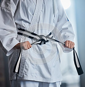 Karate, fitness and fighter with martial arts in the gym, sports motivation with black belt and defense training. Health