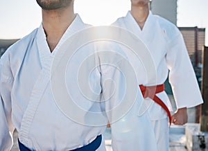 Karate, gi and men in city for training, workout and start exercise with lens flare. Martial arts, sport and people in