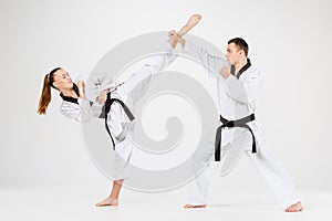 The karate girl and boy with black belts