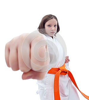 Karate girl with her fist in foreground photo