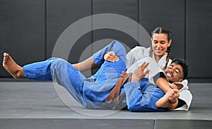 Karate, judo and aikido fighters fighting to win in martial arts fight competition to train or practice skills. Winning