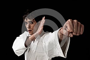 Karate male fighter close-up high contrast black photo
