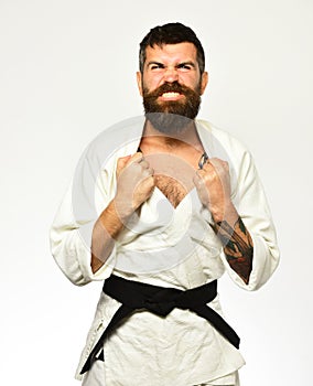 Karate man with angry face in uniform. Jiu Jitsu master