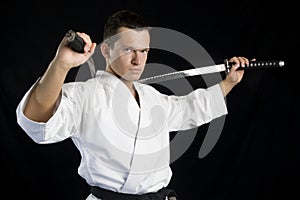 Karate man with katanas