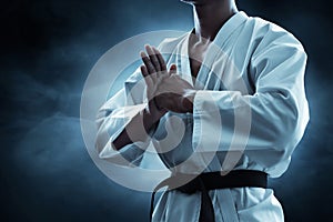 Karate martial arts fighter on dark background