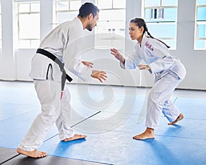 Karate, martial arts and man and woman fight, battle or practice fighting skill during training, workout or fitness
