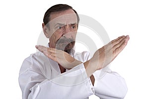 Karate position demontrated by a senior man