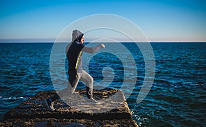 Karate training on the shores of the sea