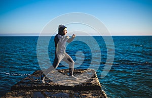 Karate training on the shores of the sea