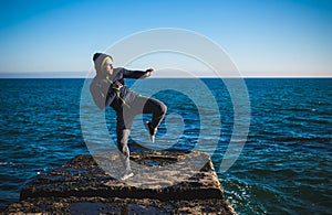 Karate training on the shores of the sea