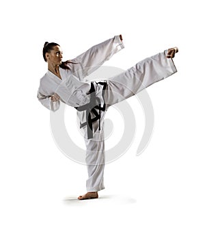 Karate woman in action isolated in white