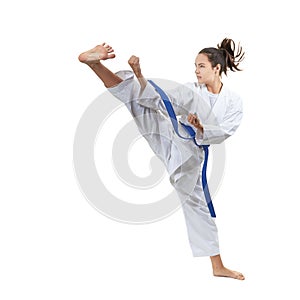 In karategi, an adult sportswoman beats blow leg photo