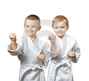 In karategi two young athlete standing in the rack karate