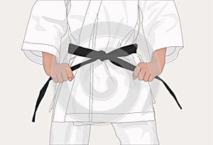 Karateka holds on to his black belt
